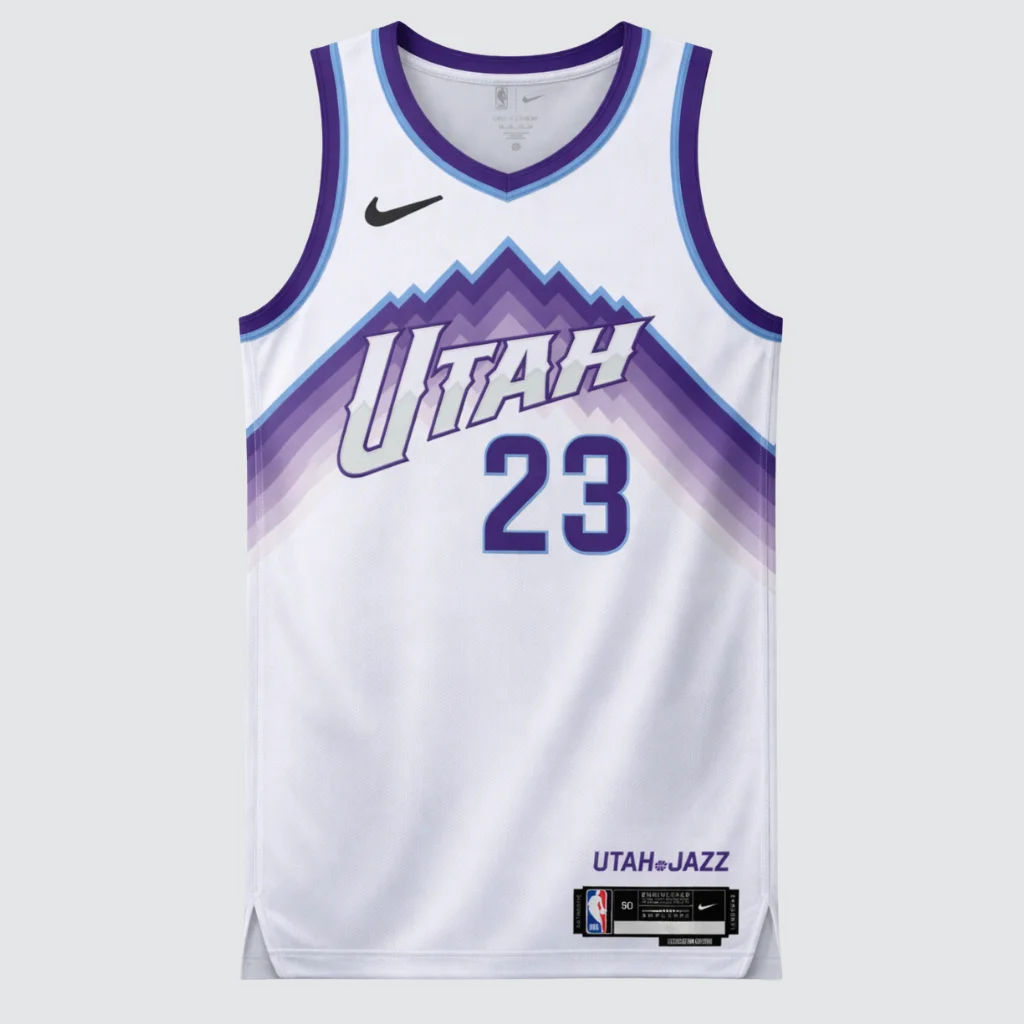 Vista frontal da regata Utah Jazz Association Edition 2025/26 em branco com detalhes azuis e número 23